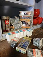 Overall view of assorted screw packs on shelf