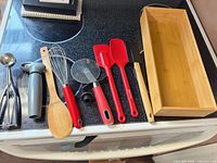 All utensils and bamboo box arranged on stovetop