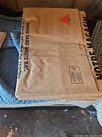 Stacked pack of folded Canadian Tire paper yard waste bags