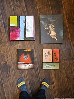 All four canvas paintings laid out together