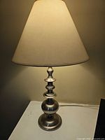 Full view of lamp showing base and shade
