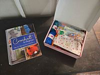 Book and open kit box showing contents