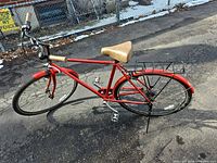 Left side view of complete red Diamondback commuter bicycle with rack and fenders