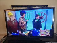 Front view powered on displaying image, shows screen condition and confirms functionality