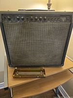 Front view of Fender Princeton 112 Plus amplifier showing grille cloth and control panel