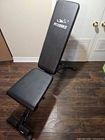 Weight bench in upright incline position