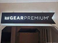 Sign illuminated showing logo and text