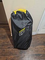 HF branded backpack carry bag standing upright