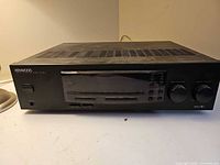 Front angled view of Kenwood KR-597 receiver showing entire unit