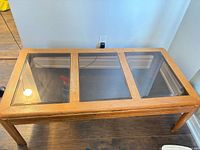 Top view showing three glass panels and wood frame