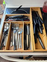 overview of drawer organizer with flatware, steak knives, shears