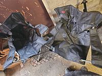 Pair of black folding camping chairs unfolded