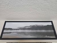 Front view of framed panoramic black and white mountain landscape print