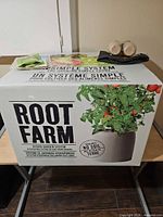Sealed Root Farm box with some accessories on lid