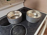 Both pet bowls top view showing size and materials