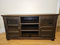 Front view of TV stand with doors closed