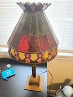 Full view of lamp unlit showing shade colors and base