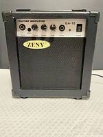 Front view of Zeny GA-10 amplifier showing grille and control panel