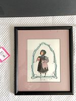 Full view of framed print showing frame, mat and artwork