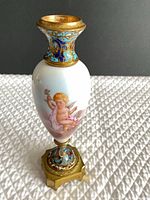 Front view showing cherub painting, enamel collar and foot