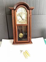 Front view of Waltham wall clock with accessories laid out