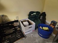 Overall lot with grill tool case, sleeping bag, bucket, pump and lantern boxes
