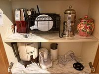 Shelf view with coffeemaker, French press and accessories