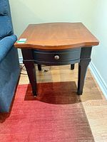Front view of end table showing drawer and legs