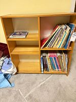 Full view of bookshelf with mixed children’s books