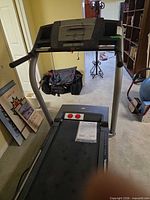 Console, handrails, and full view of treadmill front