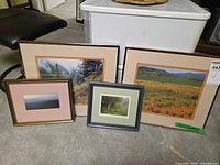 Full view of four framed landscape prints showing sizes, frames, mat colours and subjects
