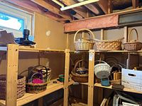 Shelving unit showing majority of baskets in various sizes and materials