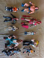 Overall view of ten assorted action figures laid out