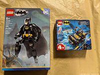 Front of LEGO 76259 Batman Construction Figure box and 4+ Batmobile box