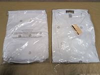 Both sealed chef jackets in plastic