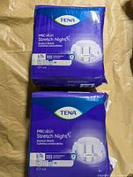 Two sealed packs of Tena ProSkin Stretch Night briefs