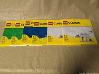 Front view showing all six sealed LEGO Classic baseplate packs