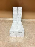 Stacked retail boxes of Baseline invisible tape