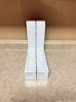 Two stacks of Baseline Invisible Tape boxes on countertop