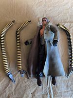 Front view of figure with four detached tentacles