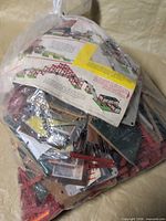 Full bag of mixed erector set pieces and instructions
