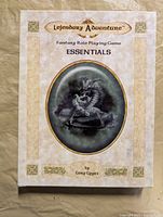 Front cover of Essentials rulebook showing title and art