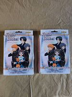 Front view showing two sealed Fruits Basket card game boxes