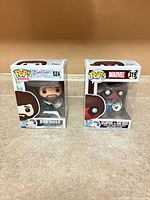 Front view of both boxed figures side by side