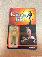 Figure still attached to card within blister