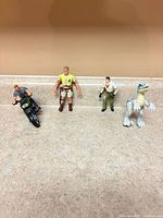 Full lot: two human figures, motorcycle, raptor