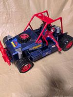 Left side view of Spider-Man dune buggy with figure seated