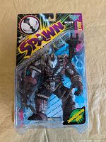 Front view of sealed Alien Spawn figure in blister package