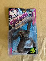 Front view of sealed Sandskier figure in blister packaging