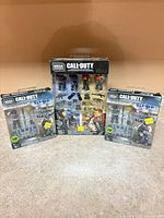 Front view of all three boxed Mega Construx Call of Duty sets